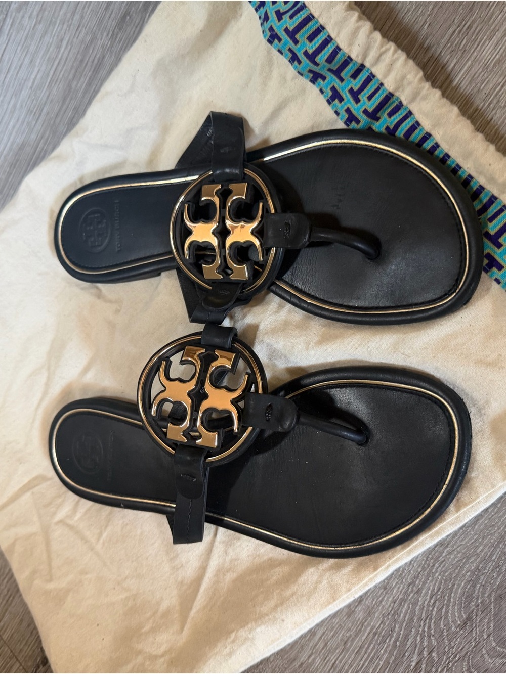 Tory Burch Black Leather Thong Sandals with Gold Logo Medallions